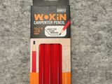 a box of waxed pencils sitting on top of a carpet