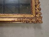a mirror hanging on the wall in a room