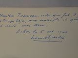 an envelope with a handwritten message on it sitting on a table