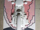 a poster of a motorcycle on the wall of a building