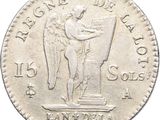 a close up of a coin with an angel on it