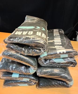 a pile of bags that have been wrapped up on a table