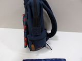 a blue backpack and a blue tie on a table