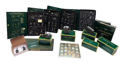 many different types of gold coins in a box
