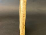 a wooden stick that is sitting on a table