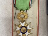 a small box with a medal and a cell phone