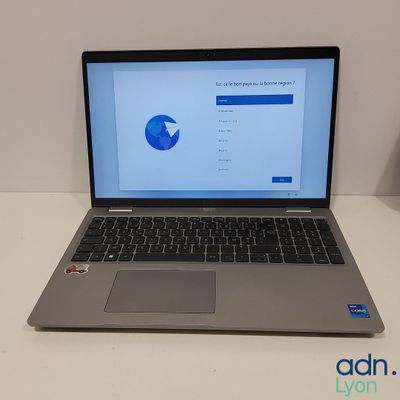 an open laptop computer sitting on top of a white table