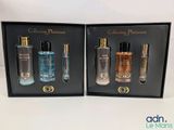deux flacons de parfum dans un coffret noir posé sur une surface blanche