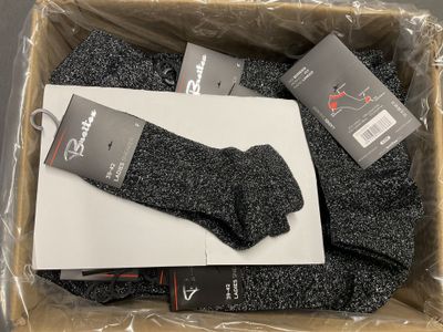 the box is full of socks and a pair of socks