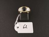 a black and white diamond ring with a price tag on a black surface