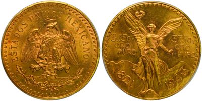 a close up of two gold coins with an angel on them