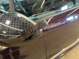 a close up of a car with a sticker on it ' s side mirror