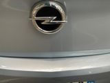 a close up of a car ' s emblem on the back of the car
