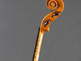 an old violin with a fiddle on top of it