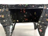 an image of a black painted desk with drawers and drawers on it