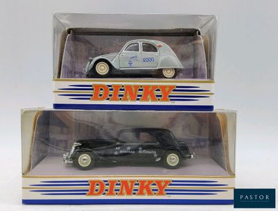 two boxed boxes of die - cast cars, one in black and one in white