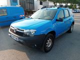a blue car that is parked in a parking lot