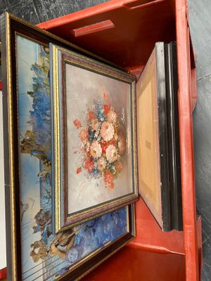 a picture of a red box with a painting inside of it