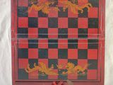 a red and black checkered box with a dragon design on it