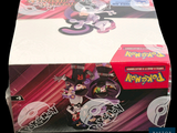 a box of pokemon trading cards on a table