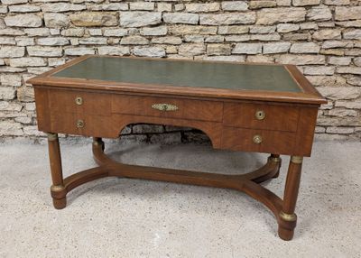 a small desk with a glass top on a stand