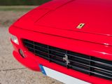 a red sports car parked on the side of the road