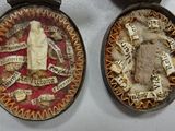 two medals that are on display on a table