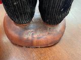 a close up of a person ' s feet on a wooden table