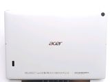 the back of a white laptop computer sitting on top of a white surface