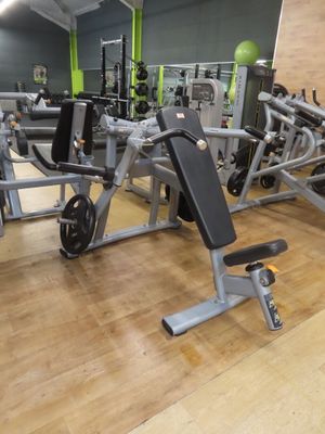 a gym with a lot of equipment in the room