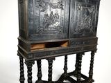 an old wooden cabinet with carvings on the doors