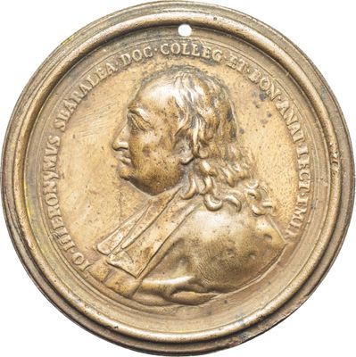 une image représentant une médaille d'or sur laquelle figure le portrait d'un homme