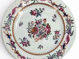 a white plate with a colorful floral design on it