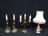 several different types of candles are lined up against a black background
