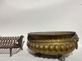 a bronze urn and a bench next to each other