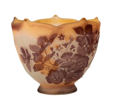 a brown and white bowl with a floral design on it