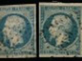 four stamps of different sizes and colors on a black background