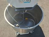 a mixer that is sitting in the middle of a parking lot