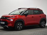 a red toyota c - hr is parked in a white room