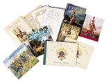 plusieurs livres sont empilés sur une surface blanche