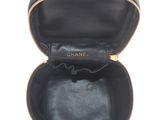 the inside of a black purse with a gold zipper