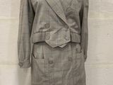 grey and white checkered jacket and skirt suit on a mannequin