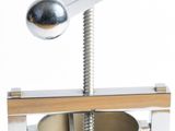 an image of a metal object with a screw in it