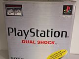 the box of the sony playstation game dual shock is sitting on the table