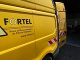 a yellow van that is parked in front of a garage