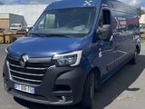 a picture of a blue van parked in a parking lot