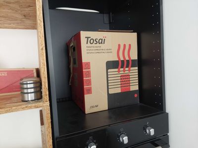 a black shelf with a box on top of it