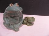 a frog and a froggy sitting next to each other on a table