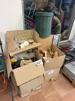 a pile of boxes sitting outside of a store