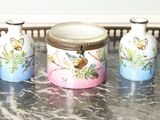three jars on a tray on a marble table